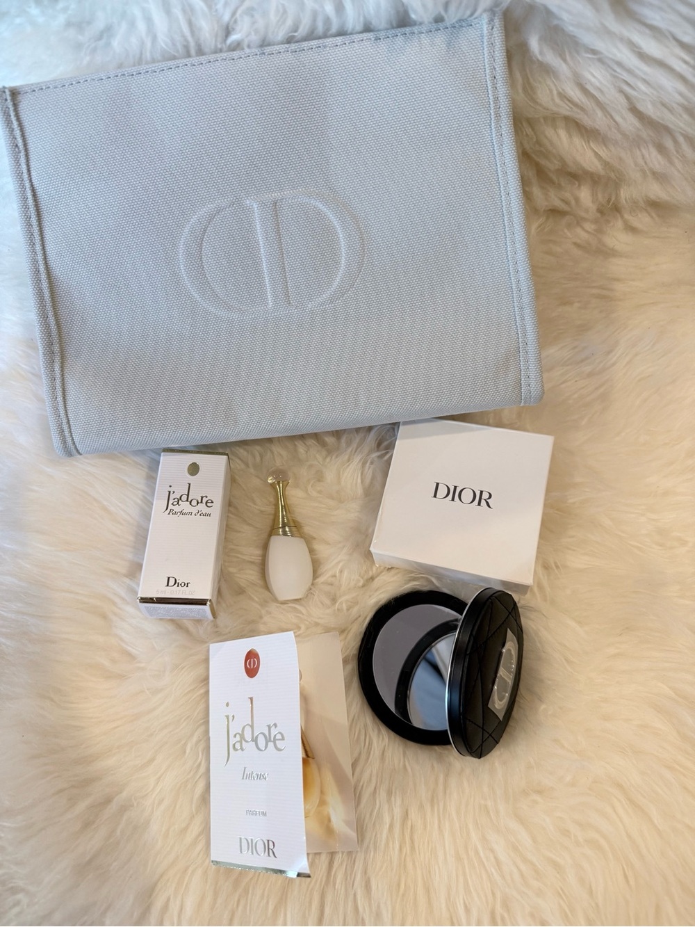 Large grey pouch with CD logo and black mirror